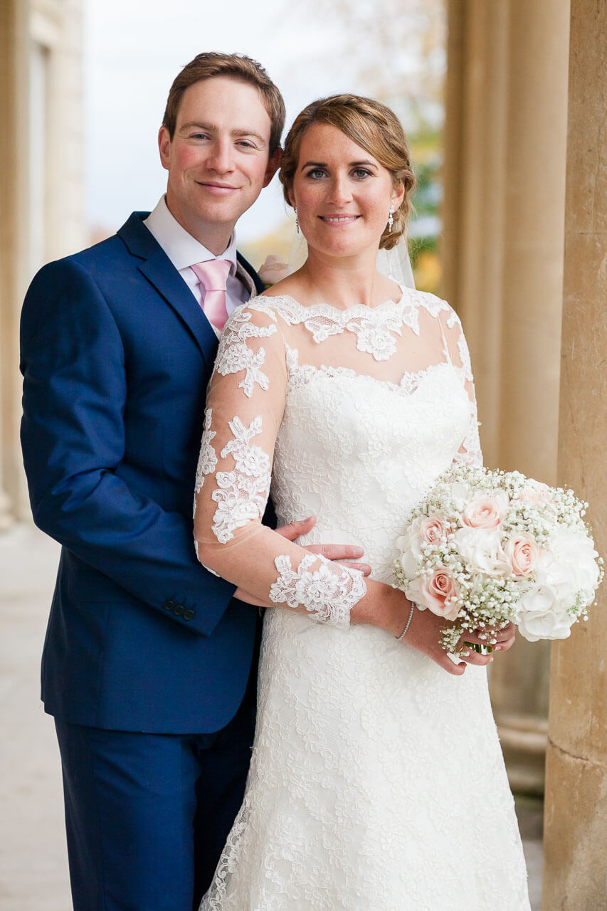 surrounded by yellow stone pillars couple looking into camera