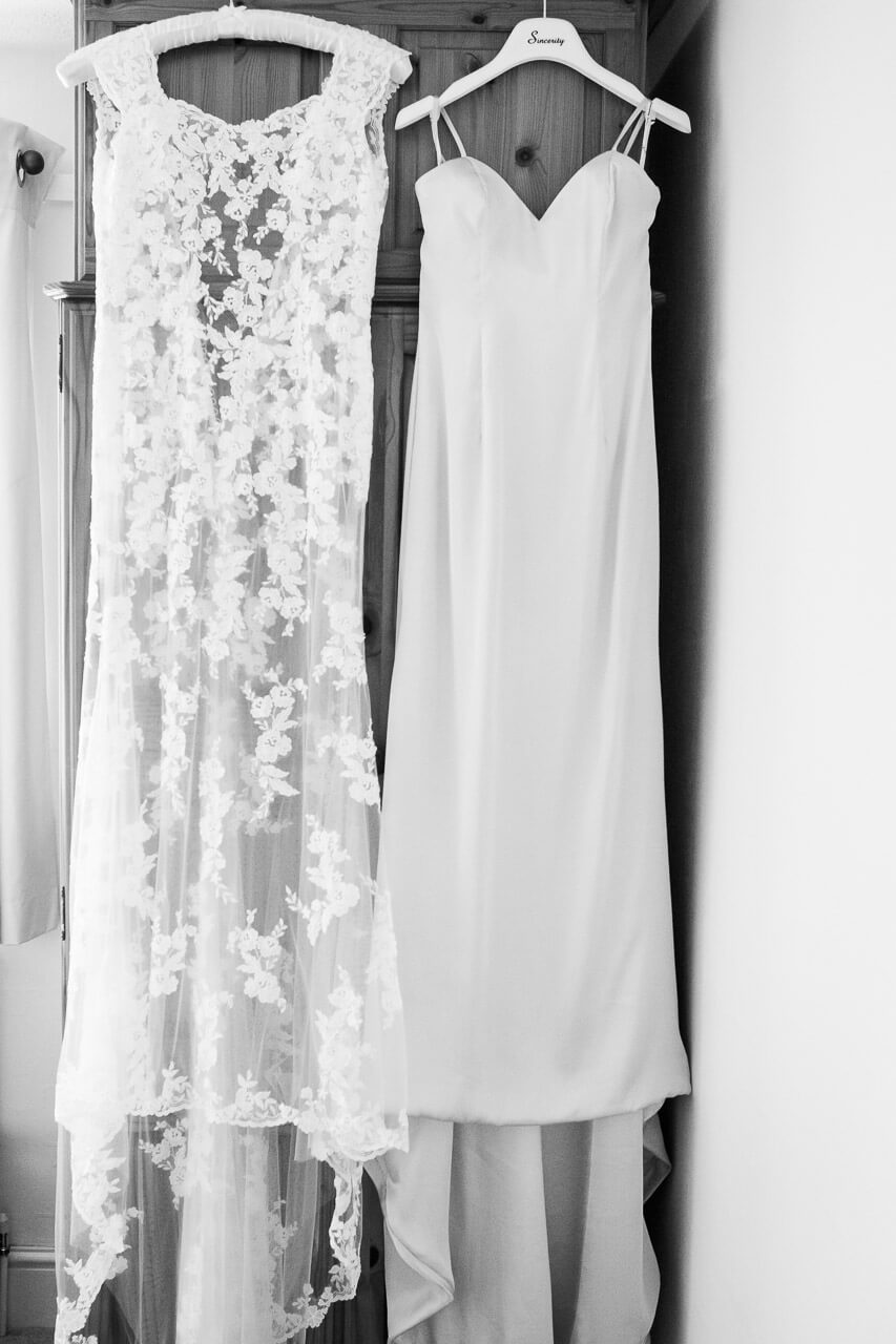 bride and bridesmaid dress hanging up