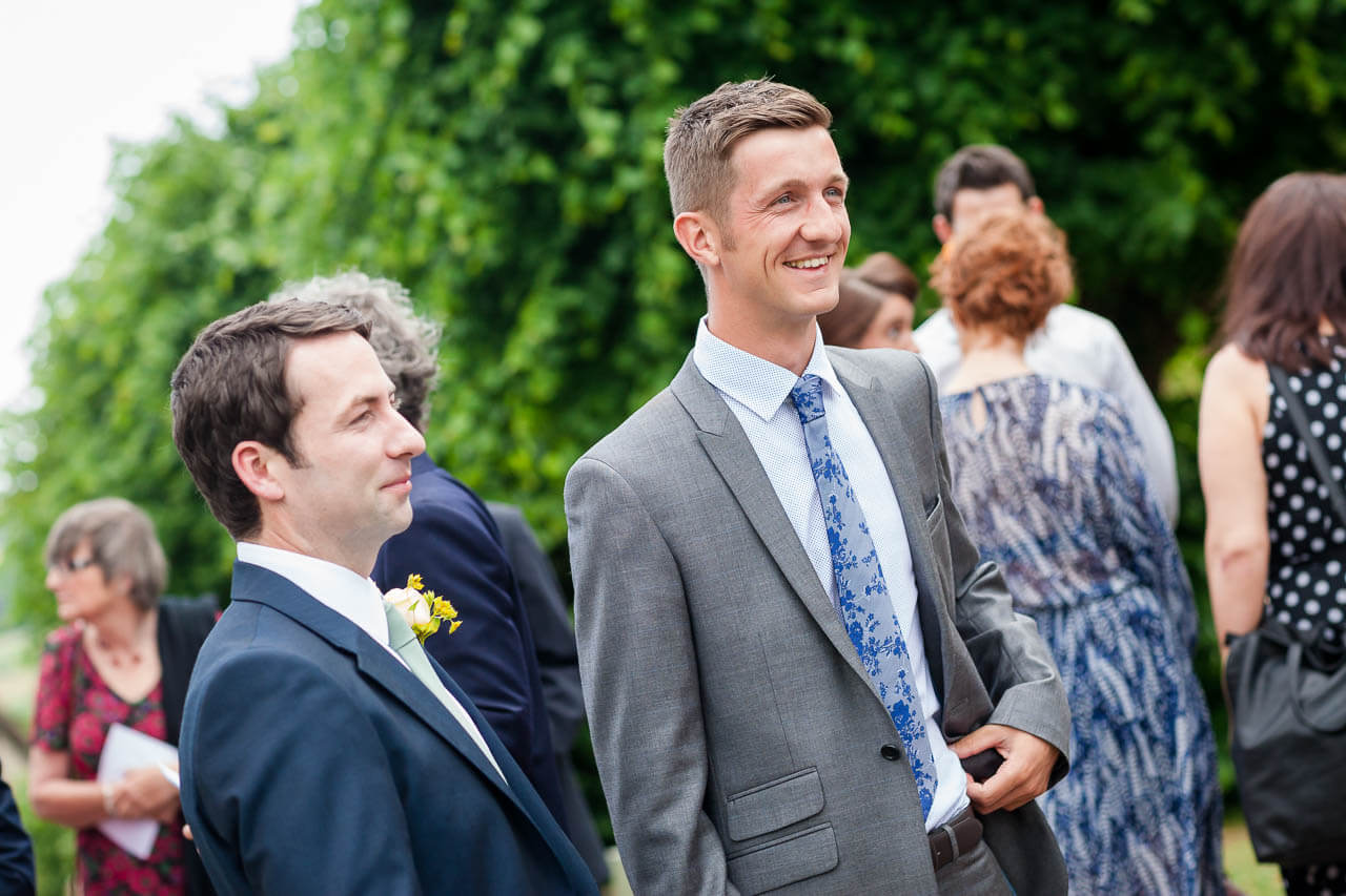 guest laughing enjoying reception drinks