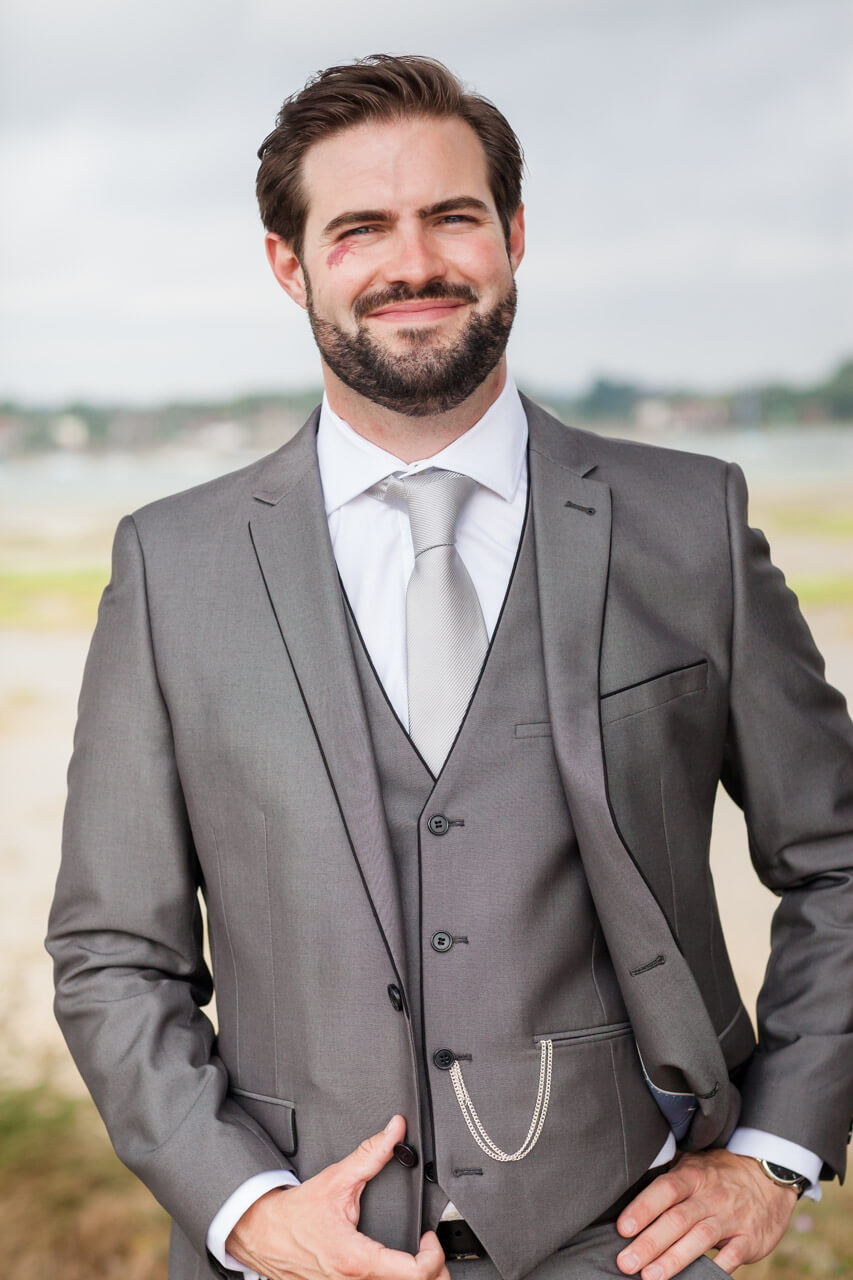 portrait shot of groom looking into camera