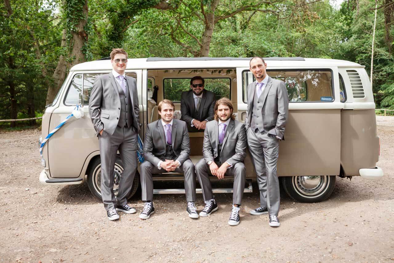 groomsmen all sitting around CAMPERVAN