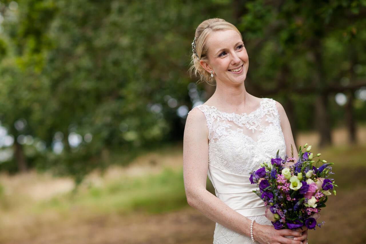 close up of bride smiling looking away from the camera