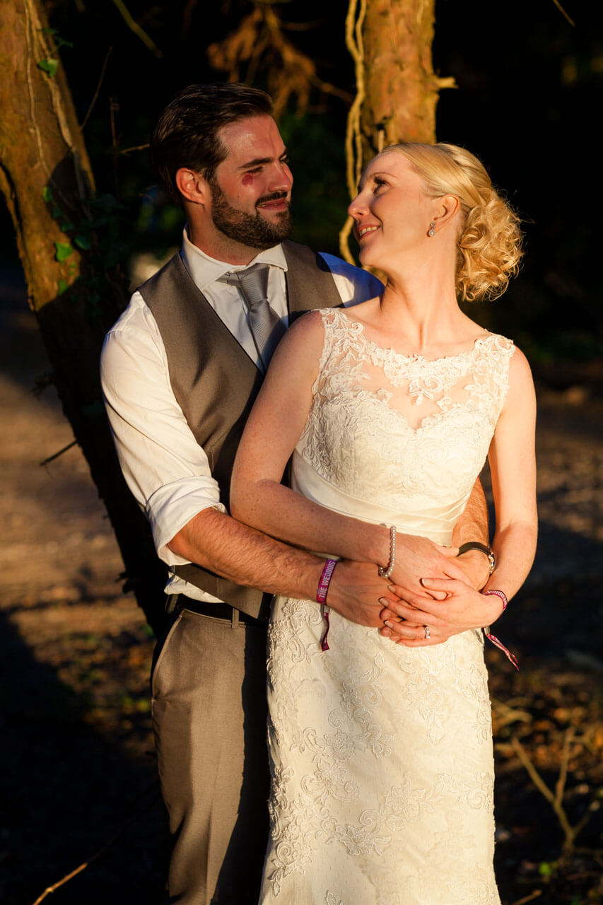 couple looking at each other with arms wrapped around waist