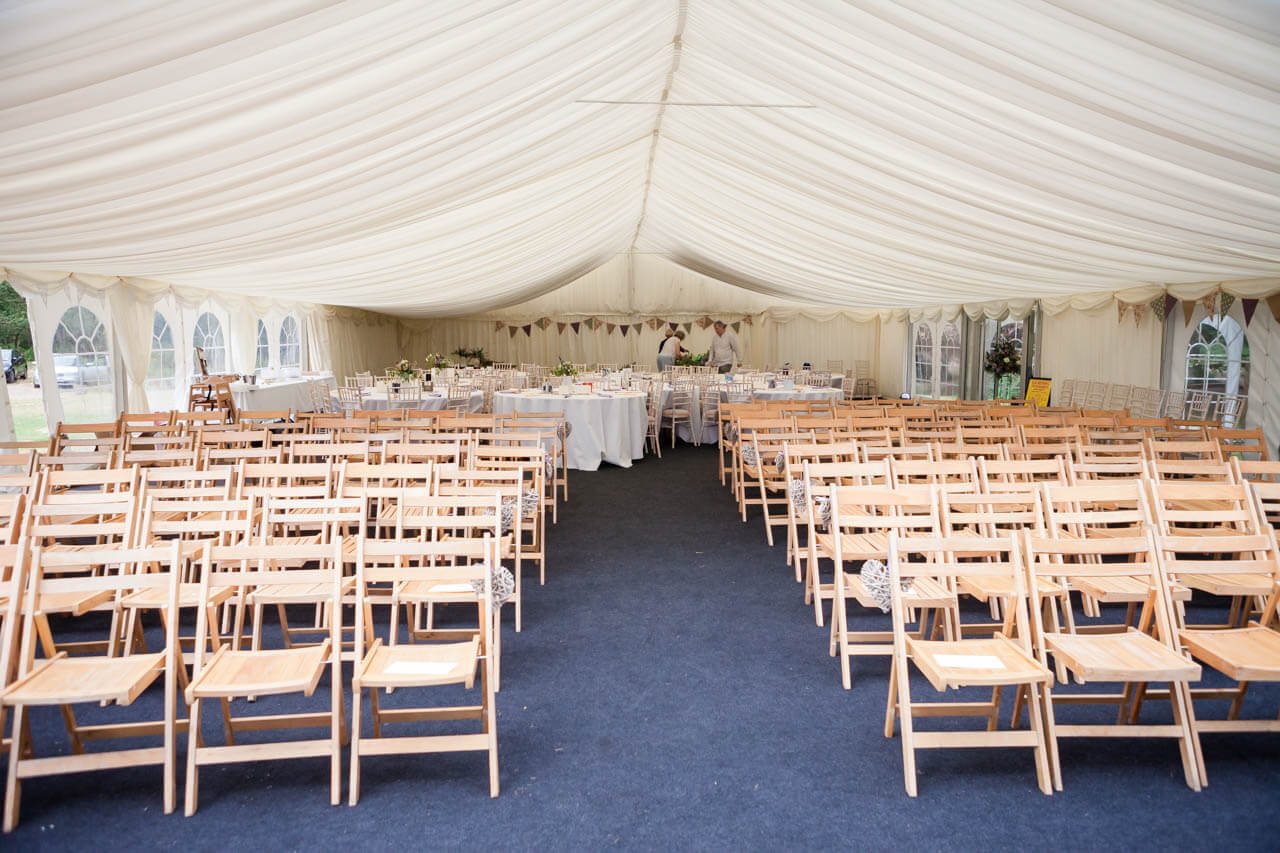 wide photo of empty marquee ready for guests