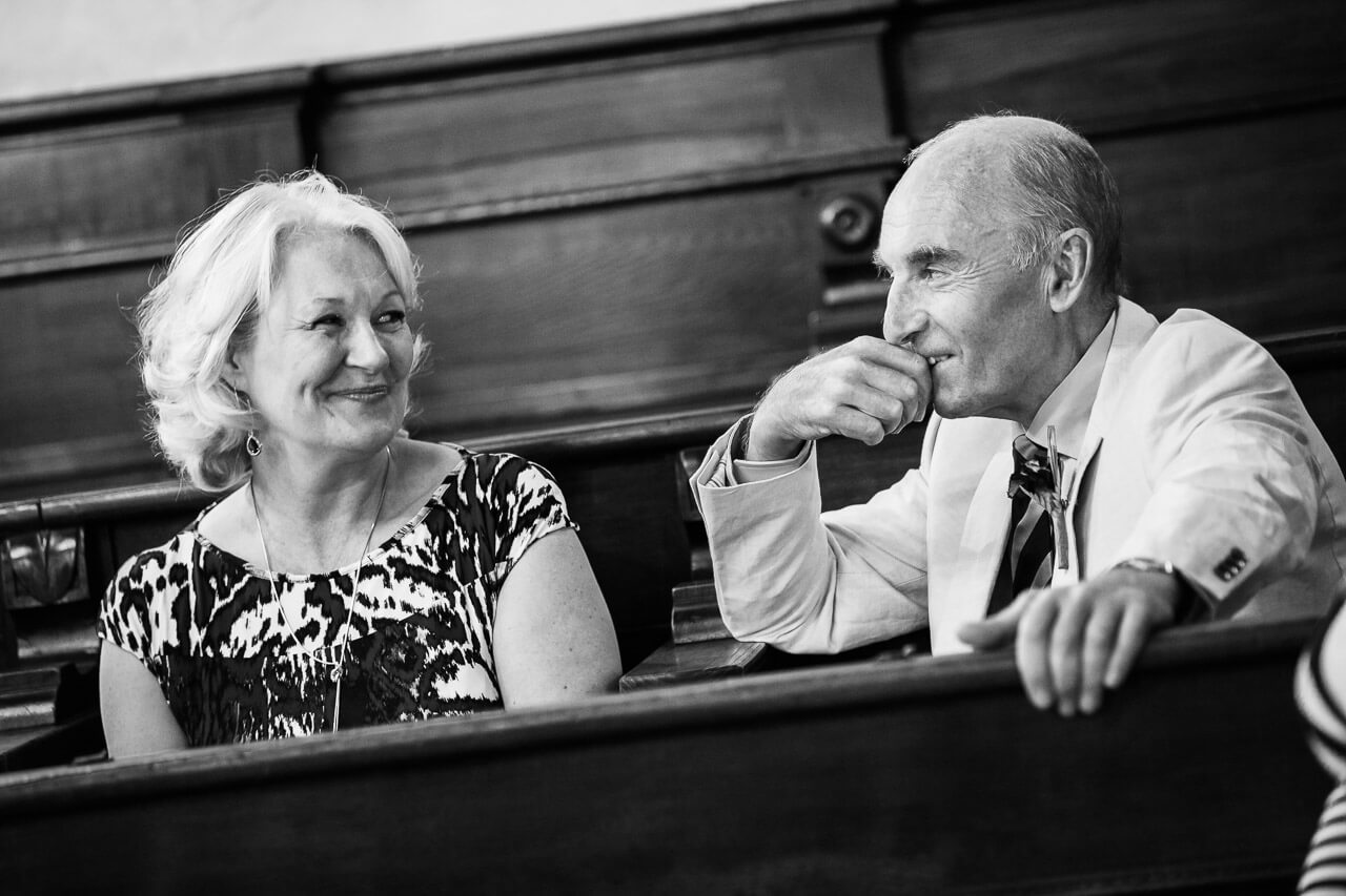 parents of the bride smiling sweetly at each other