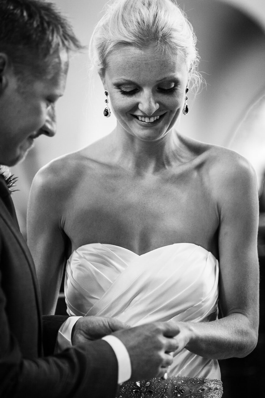 bride looks hand with new ring on