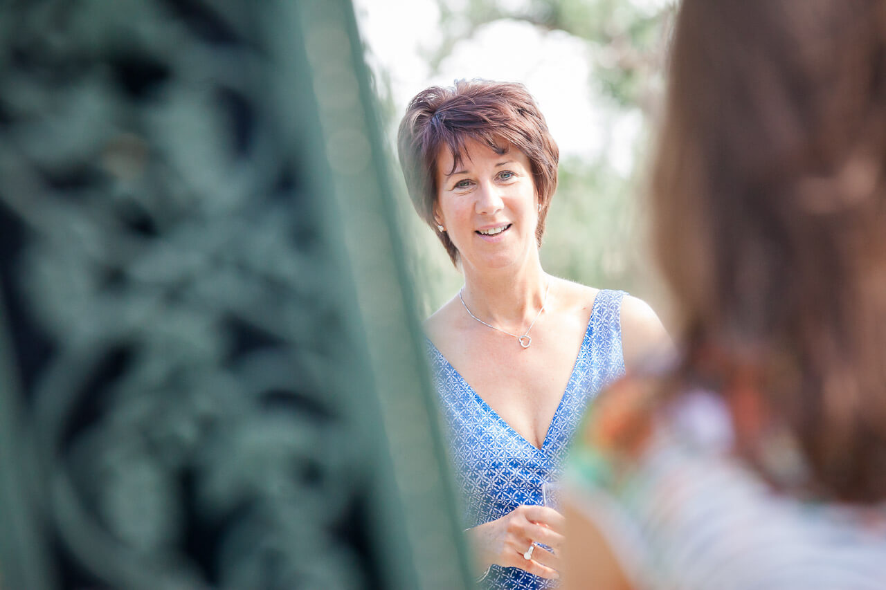 guest looking at a friend chatting