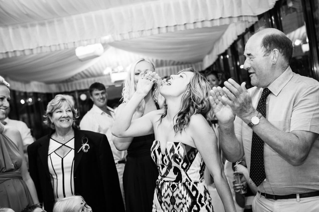 guests downs a shot of limoncello