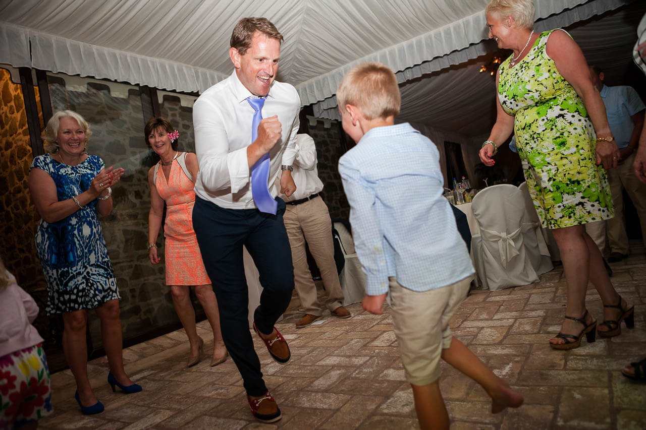 best man and kid do some breakdancing