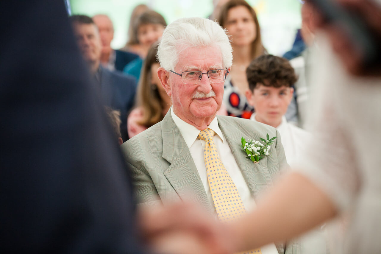 father of bride looking at daughter getting married