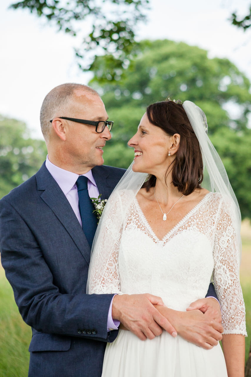 bride and groom looking at each other for portrait shot