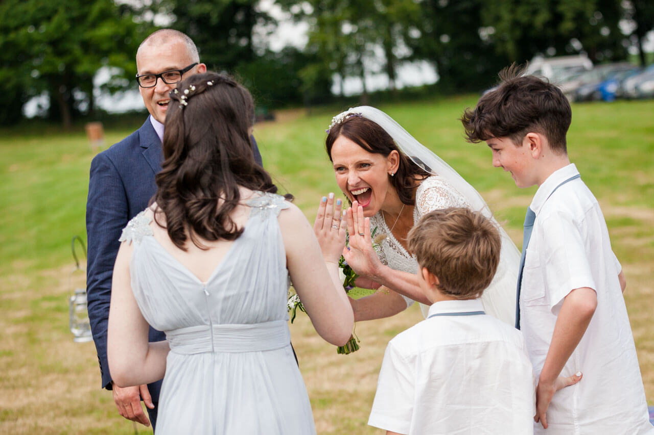 bride giving high five to her niece