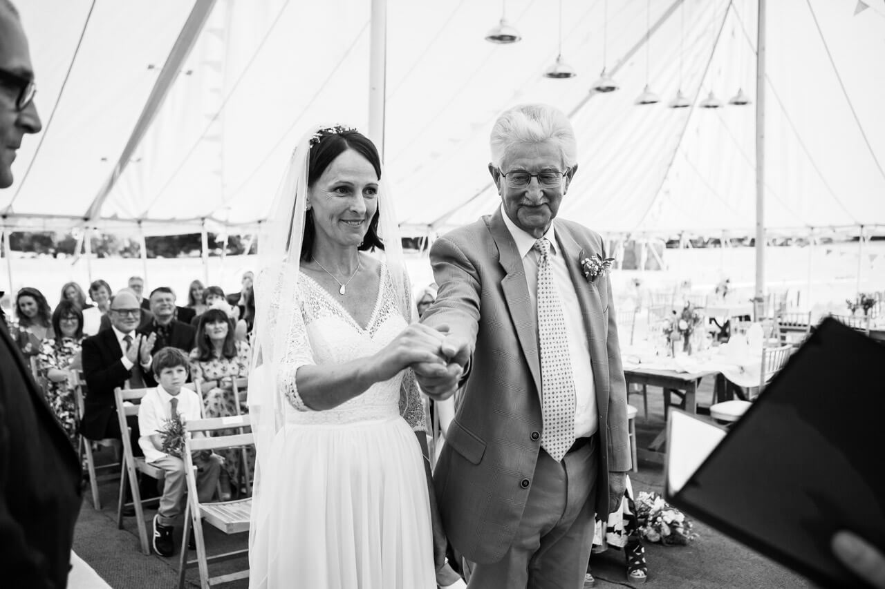 father giving his hand to his daughter