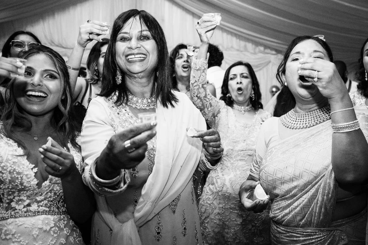 group of guests partying drinking shots