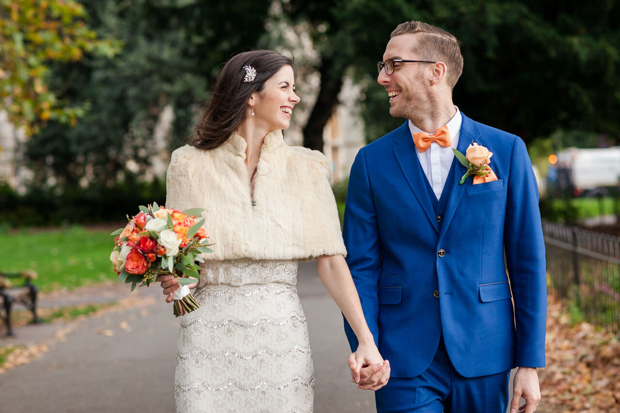 bride and groom walking arm in arm