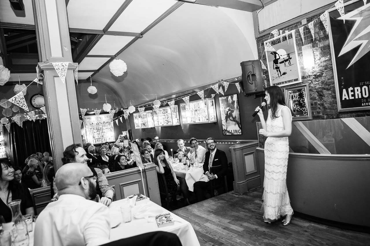 bride giving speech to the pub