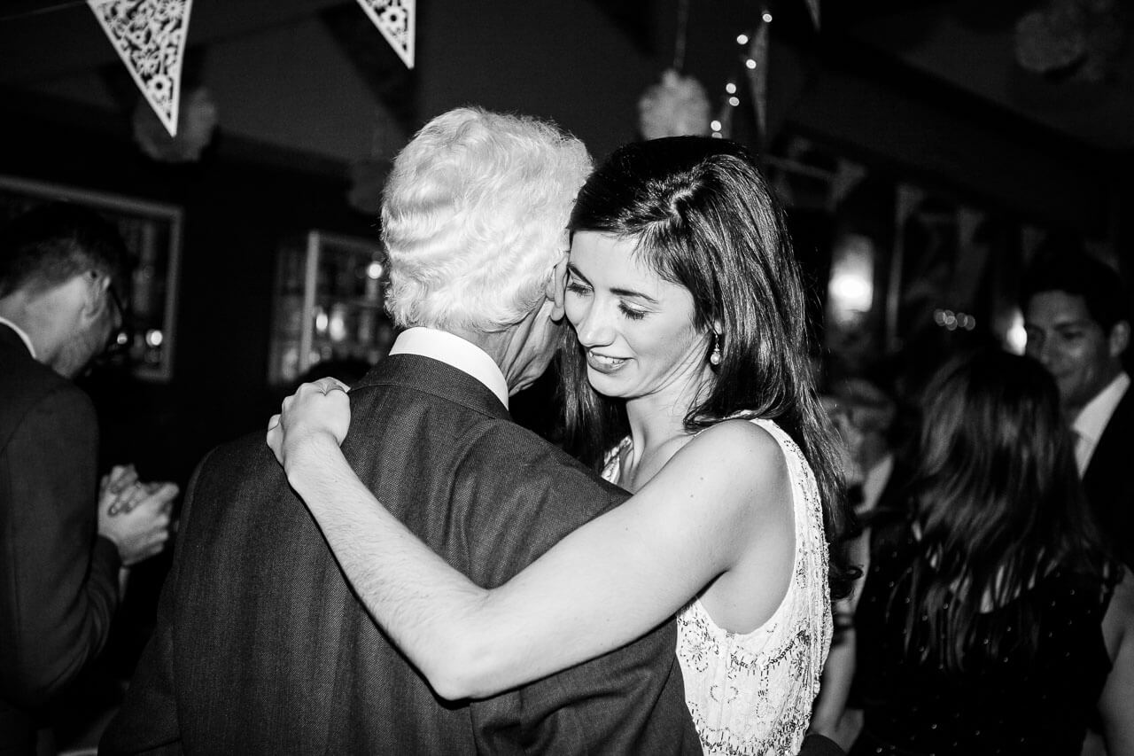 bride and father of the bride dancing