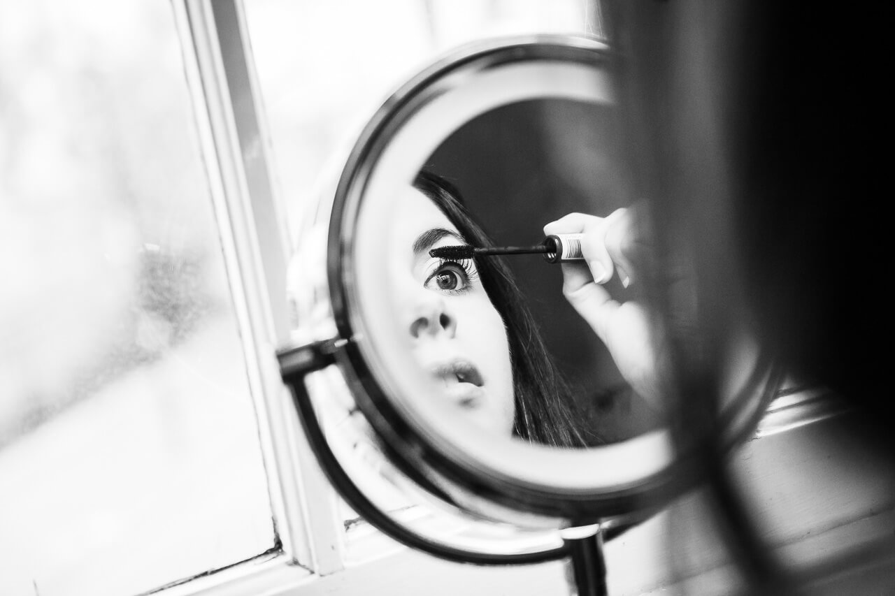 bride applying mascara