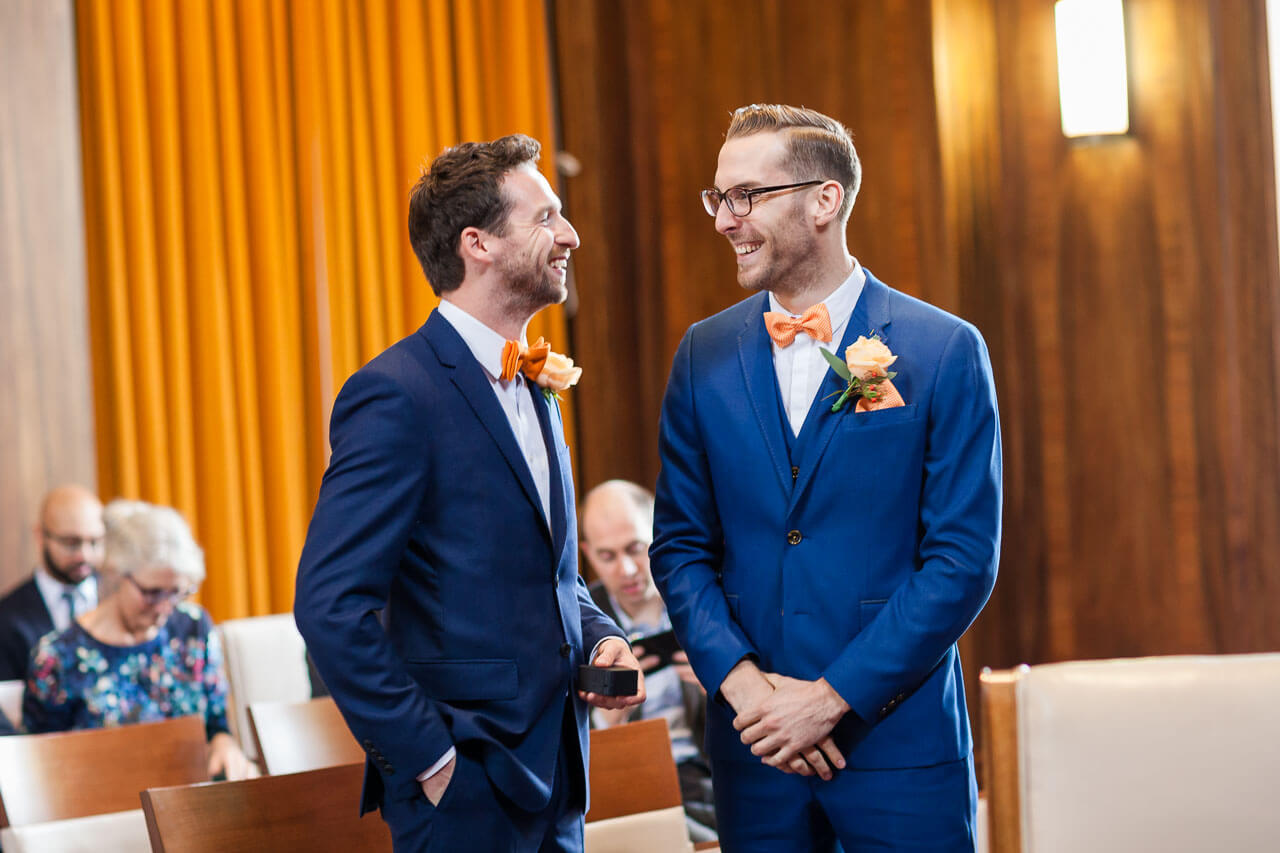 groom and best man share a joke