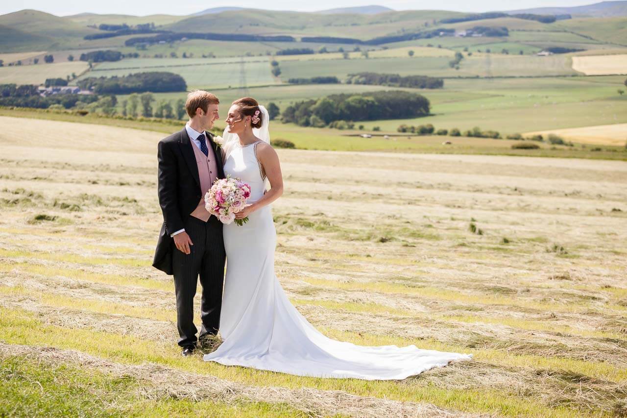 bride and groom looking at each other