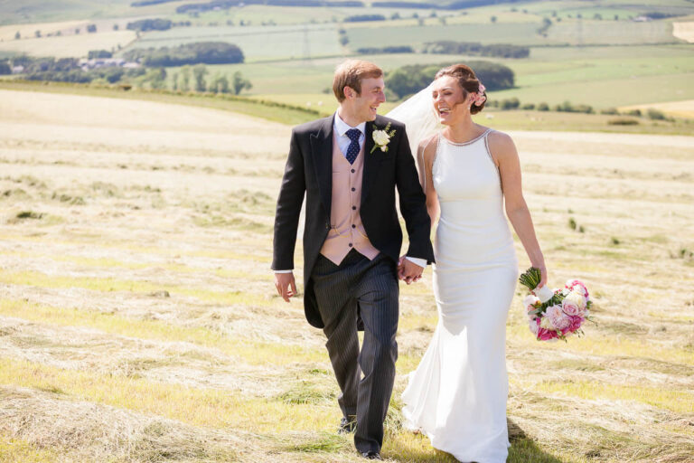 bride and groom walking and chatting
