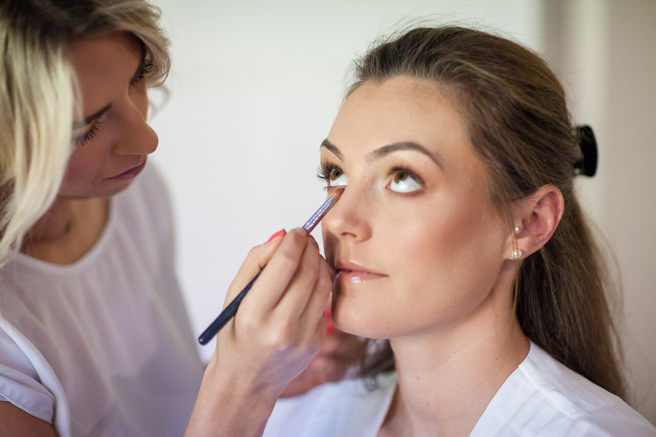 bride having mascara put on