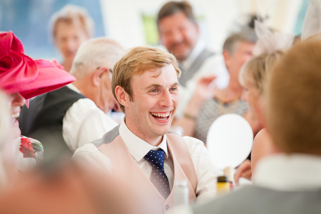 groom laughing at speech