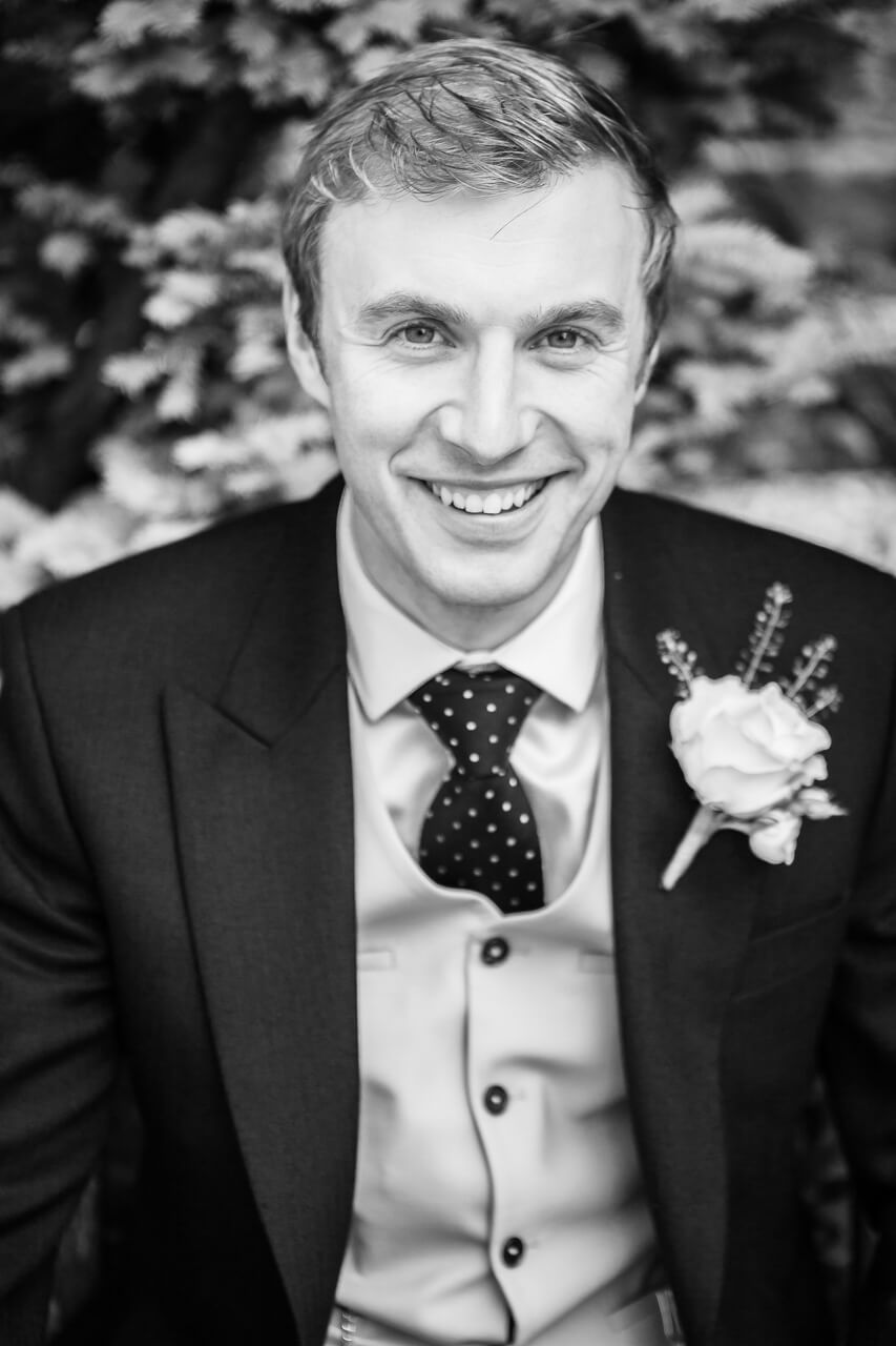 groom portrait smiling at camera