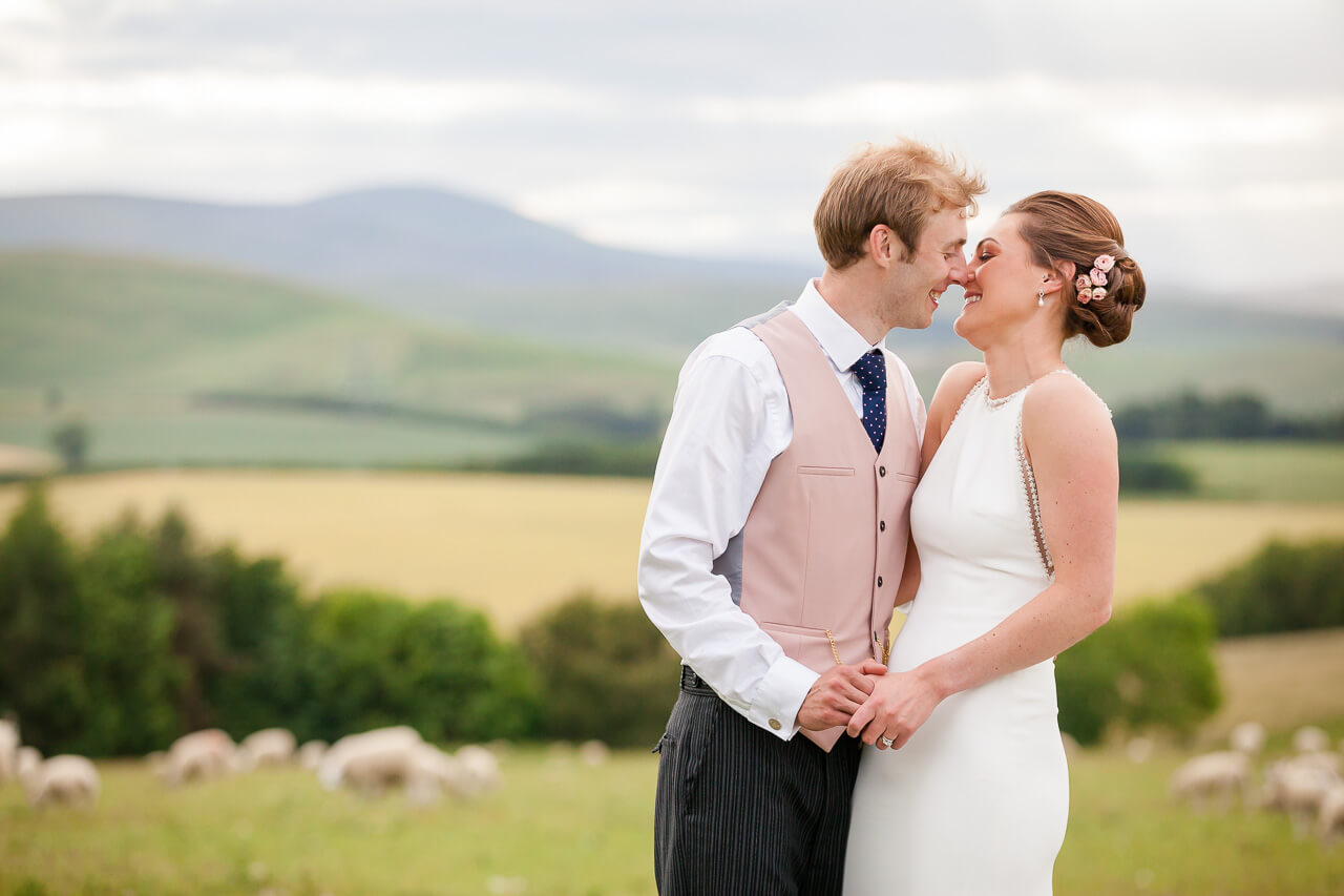 bride and groom embrace