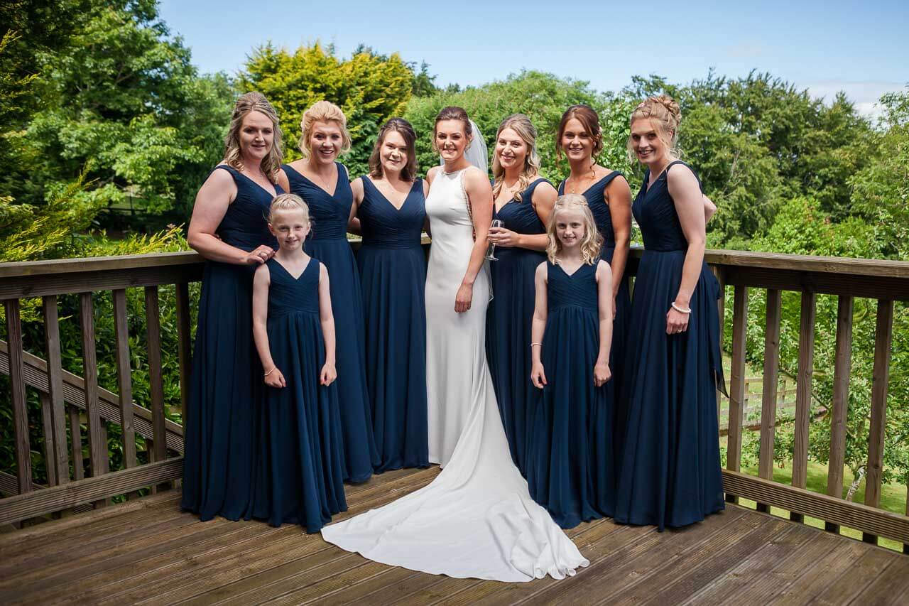 bridal party looking at camera