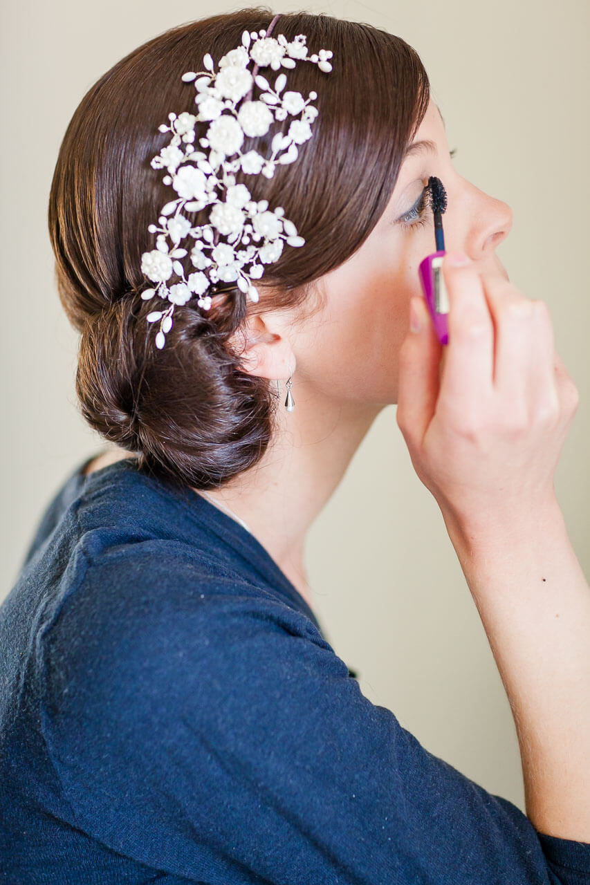 bride putting on mascara