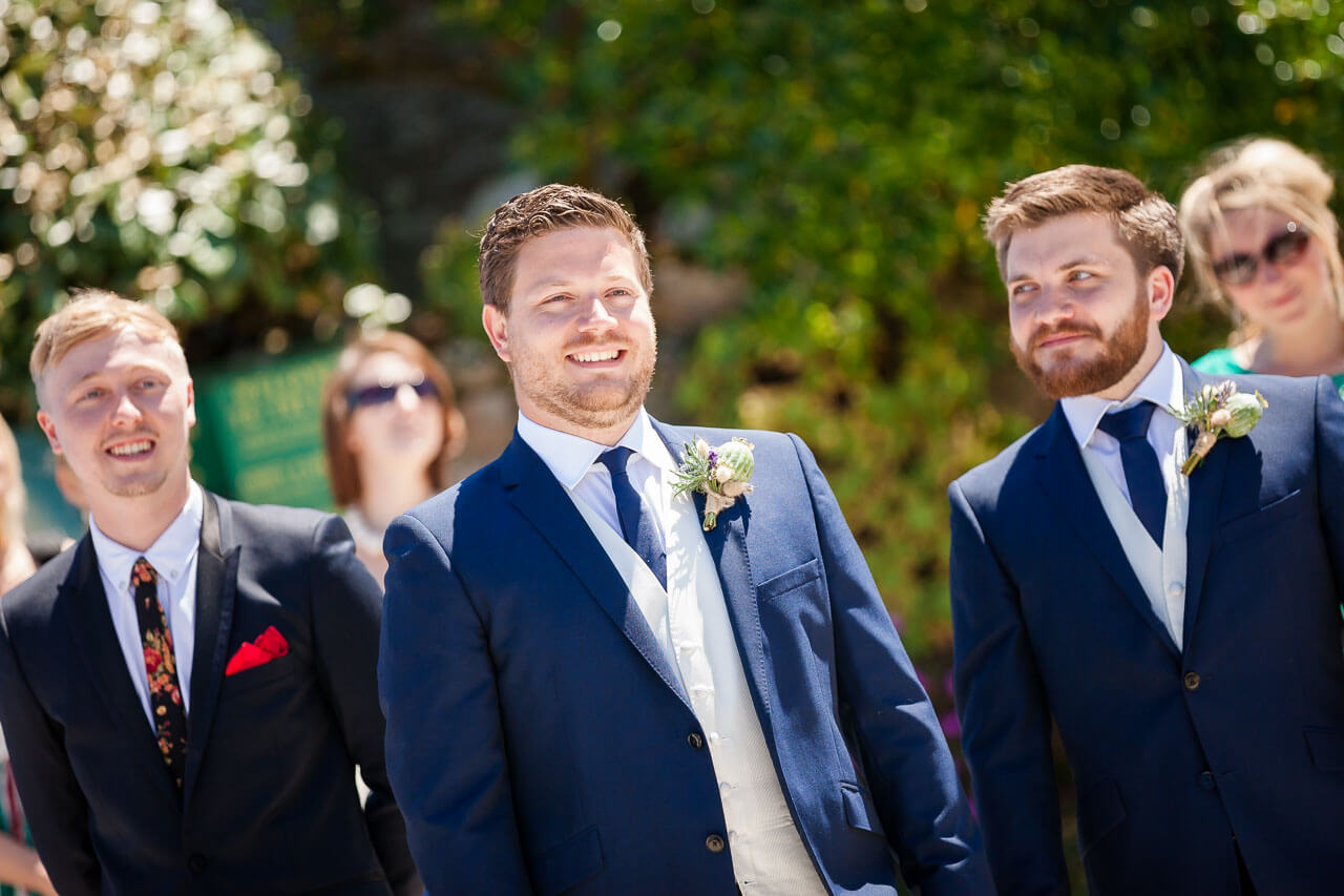 groom and best man waiting for bride