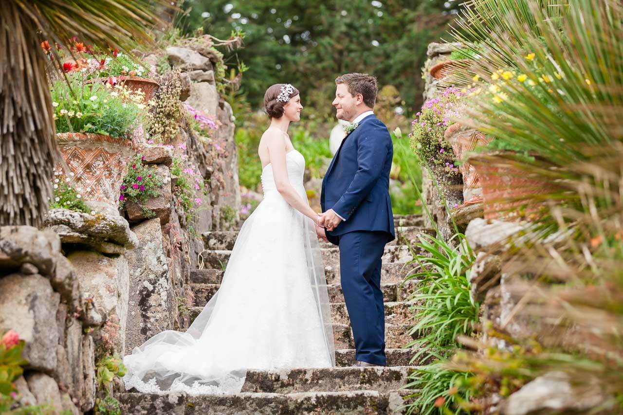 bride and groom holding hands