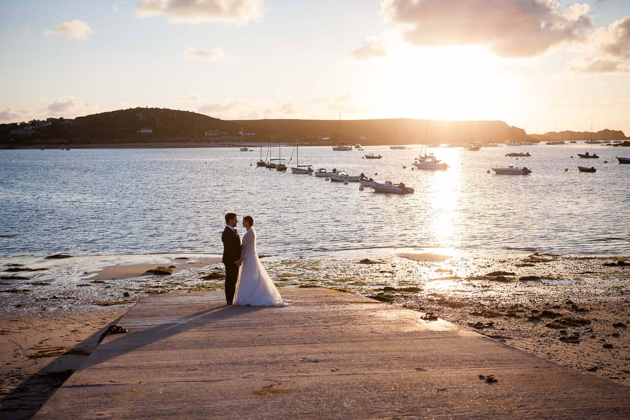 bride and groom watching sunset