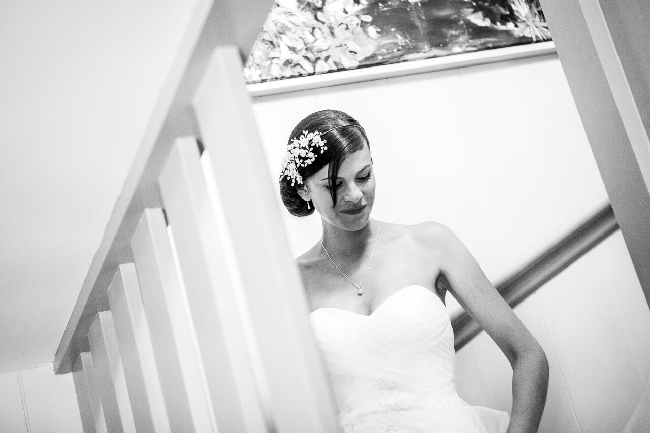 bride walks down the stairs

