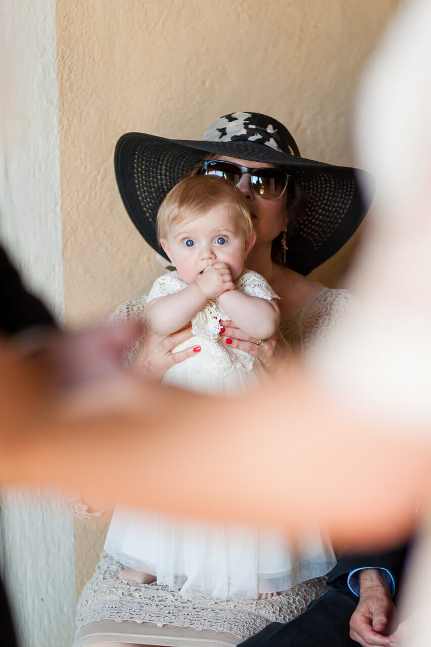 baby watching parents get married