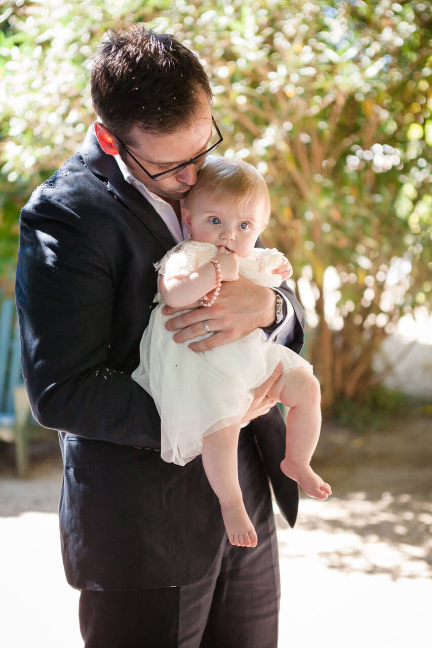 groom kissing daughter