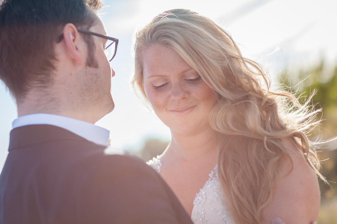 bride looking down sun shining