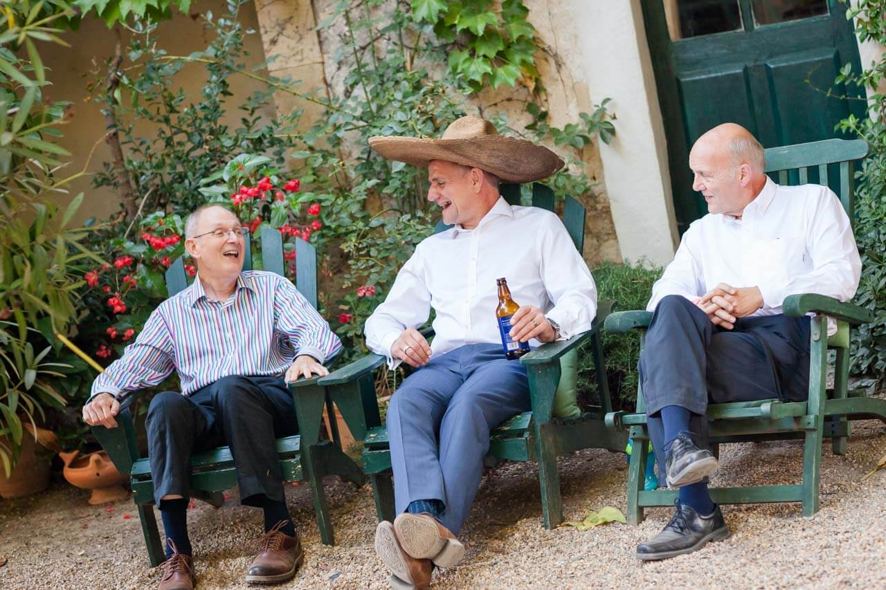 guests laughing on chairs
