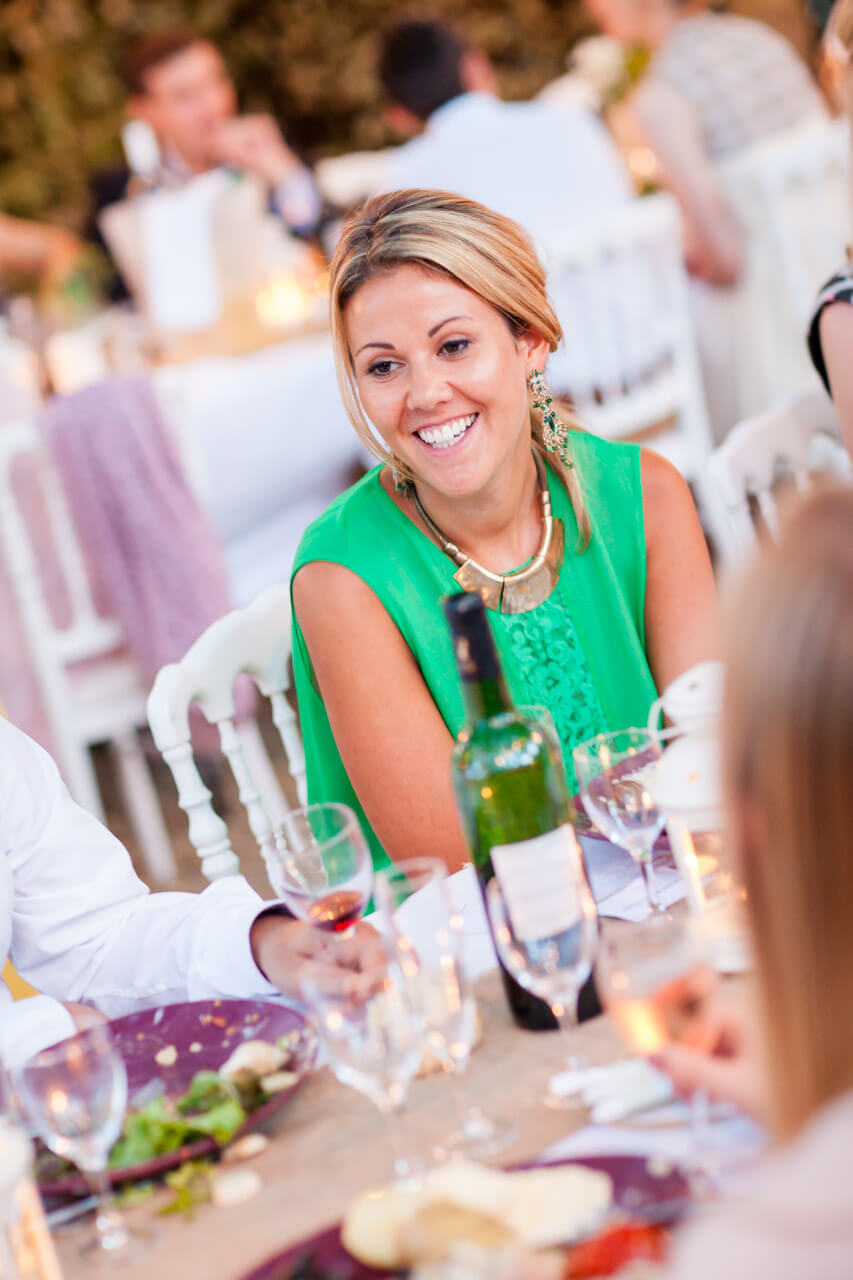 guest smiling at dinner table