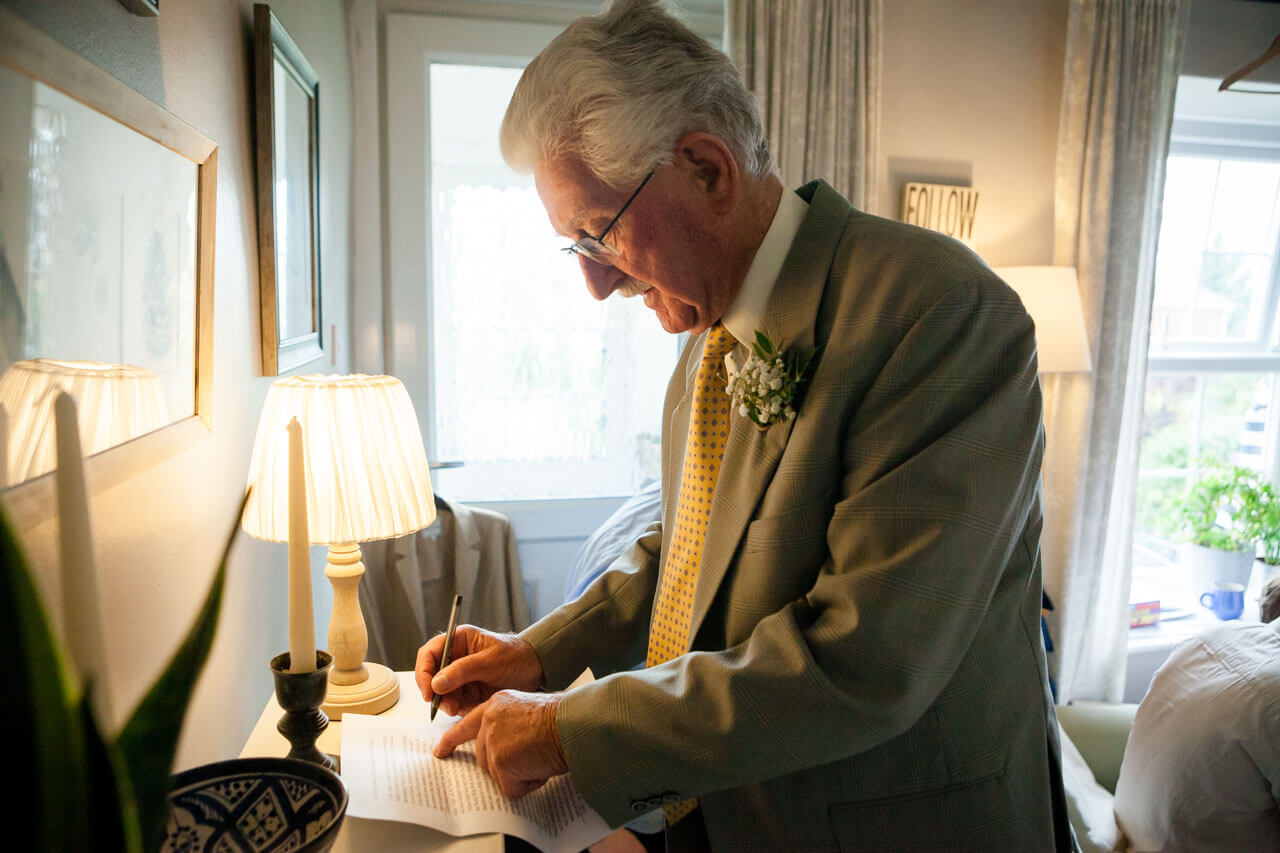 father writing speech notes
