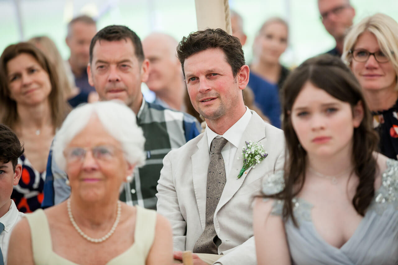 guest looks thoughtful listening to ceremony