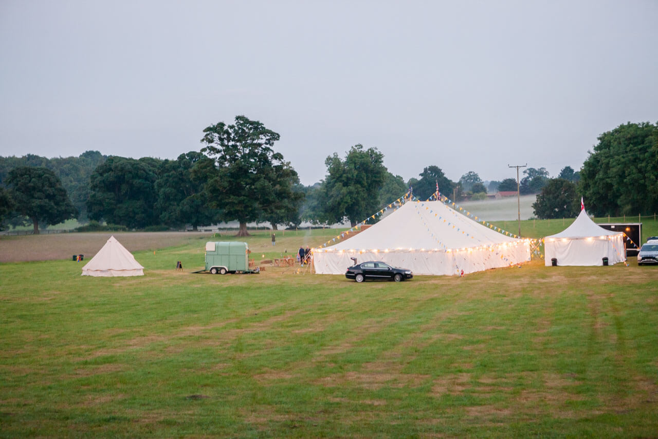 distant photo of field with marquee