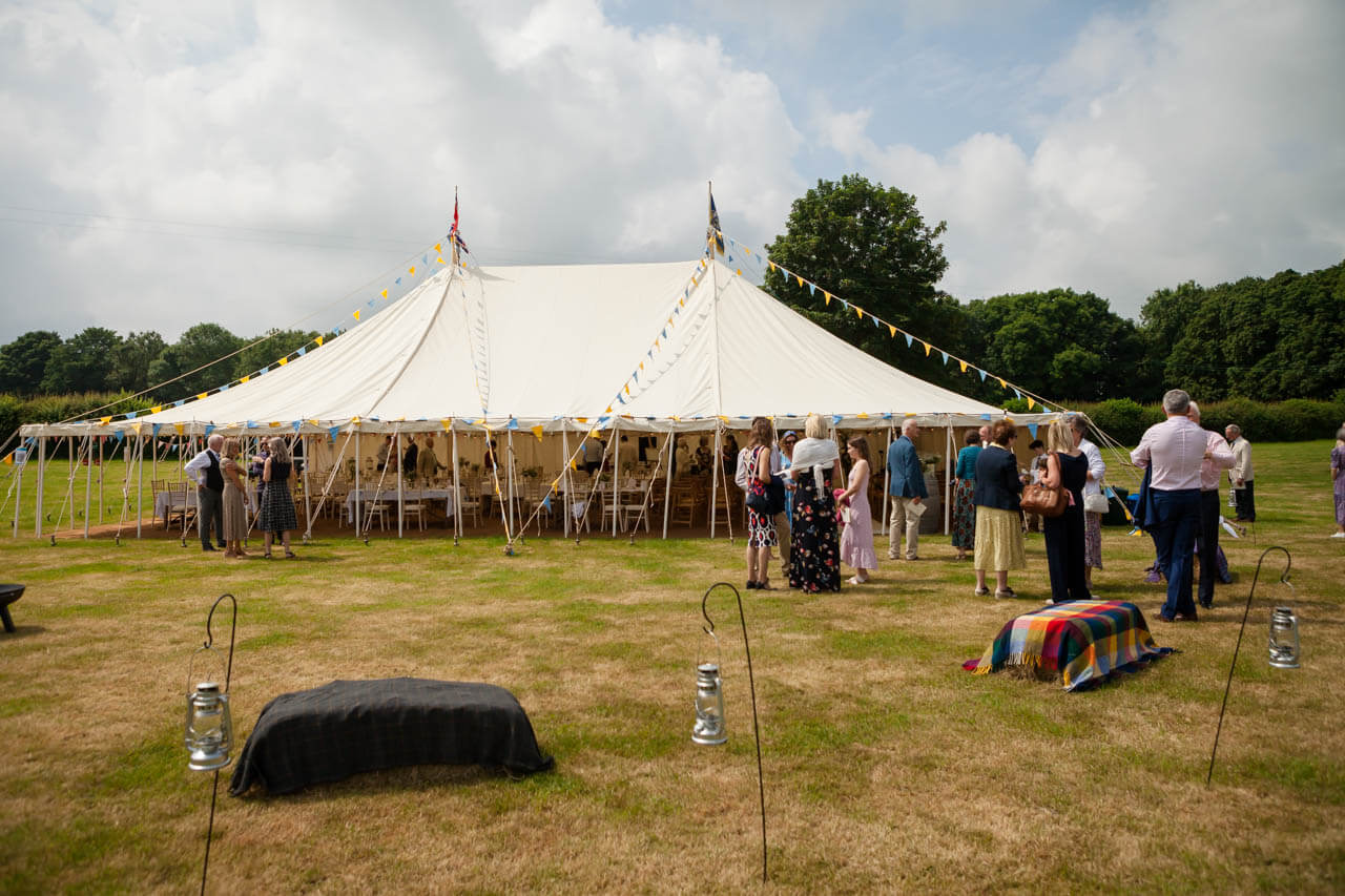 shot of marquee in a field from a distance
