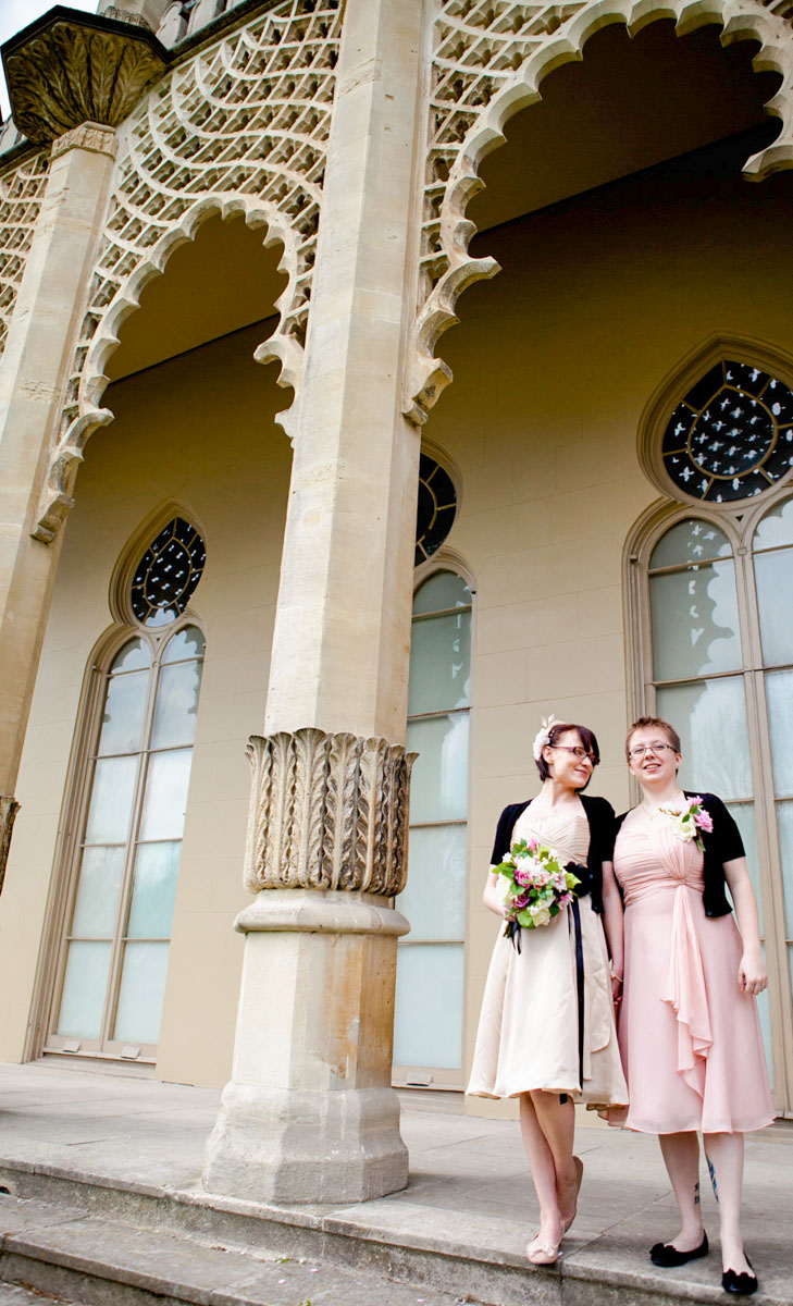 two brides on royal pavilion steps looking towards camera