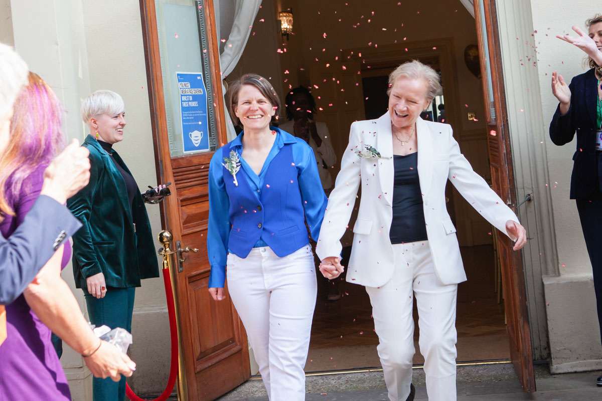 two women just married walking out of brighton town hall