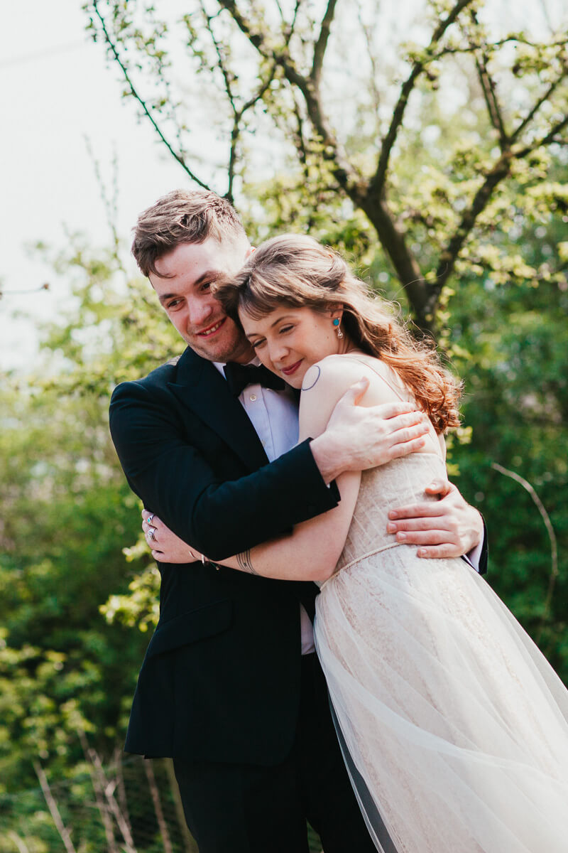 groom hugs best woman
