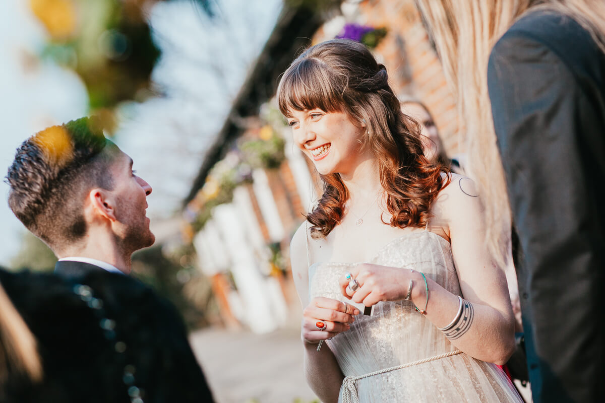 guest talking with another guest outside during reception