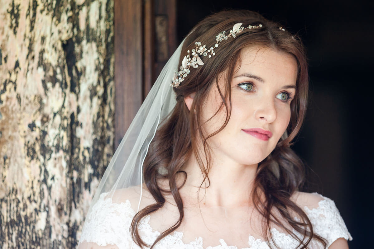 close up of bride looking away from camera with a slight smile