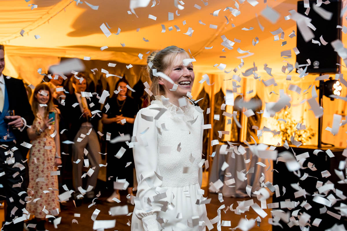 bride amid confetti bomb on dance floor